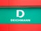 Deichmann Footwear retail company logo and store in Bucharest