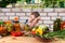 Dejected young girl bottling vegetables