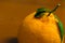 A dekopon Japanese organic orange on the wooden background