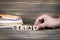 Delay. Wooden letters on the office desk