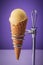 Delecious italian icecream in cone, close up on purple background