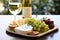 Delectable Appetizers, Artisanal Cheese Platter, Fresh Grapes, and a Glass of Crisp White Wine