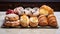 Delectable assortment of freshly baked pastries displayed on an elegant marble countertop. AI Generative