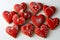 A delectable assortment of red heart-shaped cookies, each intricately decorated for Valentine\\\'s Day.