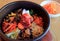 Delectable Bibimbap, a Korean Traditional Mixed Rice with Meat and Assorted Vegetables in Hot Stone Bowl