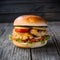 Delectable chicken burger served on rustic wooden table