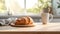 a delectable croissant and a cup of coffee elegantly placed on a kitchen countertop, the scene against a minimalist