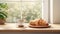 a delectable croissant and a cup of coffee elegantly placed on a kitchen countertop, the scene against a minimalist