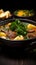 Delectable display Front view of savory meat soup with potatoes, greens on dark surface