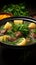 Delectable display Front view of savory meat soup with potatoes, greens on dark surface