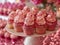 Delectable Pink Frosted Cupcakes on Elegant Display for Party or Event