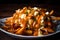 Delectable Poutine with a twist, made with crispy sweet potato fries, melty cheese curds, and spicy sriracha gravy