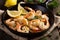 Delectable Shrimp Scampi in a Sizzling Skillet with Fresh Herbs and Lemon Wedges