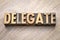 Delegate word abstract in wood type