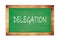 DELEGATION text written on green school board