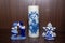 Delft Blue Figurine of girl carrying bells, kissing pair and candle