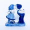Delft Blue Figurine of kissing Dutch couple. Souvenier from Holland/Netherlands. Isolated on white background
