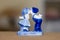 Delft Blue Figurine of kissing Dutch couple. Souvenir from Holland/Netherlands. Bokeh background