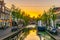 DELFT, NETHERLANDS, AUGUST 6, 2018: Sunset view of a channel in Delft, Netherlands