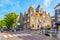 DELFT, NETHERLANDS, AUGUST 7, 2018: Typical Dutch buildings alongside a channel in Delft viewed during day, Netherlands