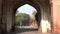 DELHI, INDIA - MARCH 15, 2019: red fort lahori gate entrance framed by an arch in delhi, india