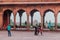 DELHI, INDIA - OCTOBER 22, 2016: Colonade around the courtyard of Jama Masjid mosque in the center of Delhi, India. Red