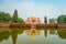DELHI, INDIA - SEPTEMBER 19, 2017: Beautiful artificial fountain with a Mogul King Humayun`s Tomb reflected in the water