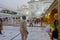 DELHI, INDIA - SEPTEMBER 19, 2017: Unidentified people walking in the plaza in front of the Famous Sikh gurdwara Golden