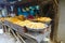 Delhi, India - September 25, 2017: Outdoor view of small retail shop with fryed food inside of bowls in Paharganj Delhi