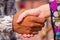 Delhi, India - September 27, 2017: Close up of unidentified people clenching his hands at the enter of the temple of