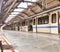 Delhi metro train at a less crowded metro station in New Delhi in the noon time