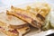 Deli style Reuben sandwich with pickles and potato chips