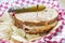 Deli style Reuben sandwich with potato chips and a pickle