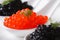 Delicacy red and black caviar fish macro horizontal