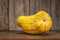 Delicata winter squash against rustic wood