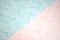 A delicate background consisting of two parts - pink and blue, divided diagonally with the texture of leaves