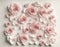 A delicate background crafted from cut paper roses. Ideal for art, crafts, and romantic concepts