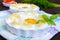 Delicate baked egg Orsini eggs in the cloud. French breakfast
