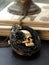 A delicate black lace locket with a miniature skull charm. Gothic art. AI generation