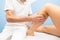 Delicate calf massage in a professional physiotherapist`s studio