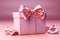 Delicate charm: Open gift box, pink bow on pastel pink background.