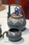 Delicate Chinese teapot and teacups close-up