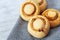 Delicate crispy cookies in form of mushrooms. Baked sweet biscuits on blurred background