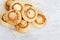 Delicate crispy cookies in form of mushrooms. Baked sweet biscuits on wood board