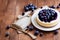 Delicate delicious cheesecake decorated with fresh blueberries on plate