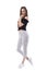 Delicate female fashion model in trendy striped pants smiling and looking at camera with hand under chin.