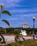 A delicate flower of Philadelphusagainst the background of the sights of Yaroslavl. Assumption Cathedral; stele of the Millennium