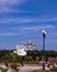 A delicate flower of Philadelphusagainst the background of the sights of Yaroslavl. Assumption Cathedral; stele of the Millennium