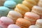 Delicate French macarons in a rainbow of pastel colors, offering a symphony of flavors with each bite.
