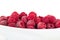 Delicate frozen red raspberries